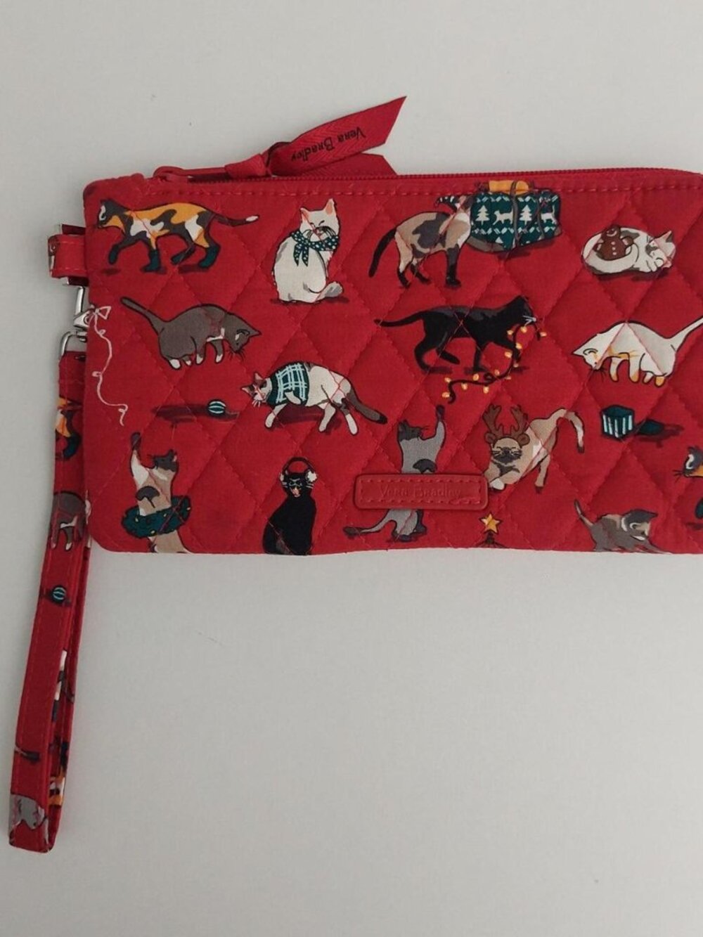 Red Vera Bradley holiday cats meow wallet with cats in various poses and outfits